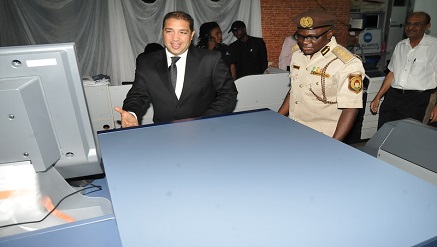 L-R: Mr Izzat Debs, Managing Director, Skysat Technologies Nigeria Ltd., with Mr David Shikfu Parradang, Comptroller-General, Nigerian Immigration Service and Special Guest of Honour during the official unveiling of Konica Minolta Bizhub Press C1100 digital printing machine recently in Abuja.