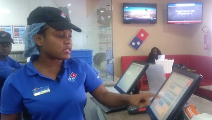 Domino’s Pizza staff showing customer data computation system