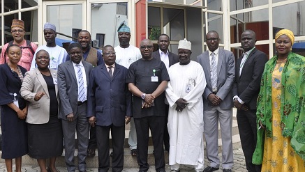 Dr Vincent Olatunji  NITDA's acting director general, flanked by management staff during training in Abuja.