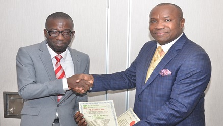 (L-r): Raheem Olabode, executive director, CMC Connect Limited, receiving the certificate of Fellowship of The Institute of Management Consultants (IMC) from Dr. Elijah Ezendu,, executive member, Lagos State Chapter of the Institute, during the conferment of Fellowship Certificate ceremony of IMC in Lagos recently.